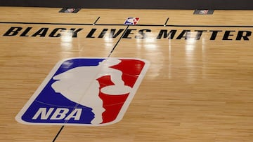 (FILES) In this file photo taken on August 27, 2020 The Black Lives Matter logo is seen on an empty court as all NBA playoff games were postponed today during the 2020 NBA Playoffs at AdventHealth Arena at ESPN Wide World Of Sports Complex on in Lake Buena Vista, Florida. - NBA revenues fell 10% to $8.3 billion for the 2019-20 season disrupted by the Covid-19 pandemic, ESPN reported October 28, saying the league lost $800 million in ticket income alone. (Photo by Kevin C. Cox / GETTY IMAGES NORTH AMERICA / AFP)