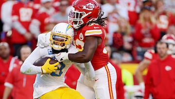KANSAS CITY, MISSOURI - OCTOBER 22: Keenan Allen #13 of the Los Angeles Chargers is tackled by Nick Bolton #32 of the Kansas City Chiefs during the fourth quarter at GEHA Field at Arrowhead Stadium on October 22, 2023 in Kansas City, Missouri. Jamie Squire/Getty Images/AFP (Photo by JAMIE SQUIRE / GETTY IMAGES NORTH AMERICA / Getty Images via AFP)