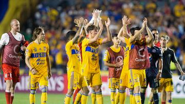 Mexico's Tigres players celebrate the end of the game against Honduras's Motagua during the CONCACAF Champions League football match at the Universitario stadium in Monterrey, Mexico, on April 13, 2023. (Photo by Julio Cesar AGUILAR / AFP)