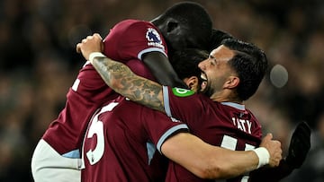 West Ham United's Greek defender #15 Konstantinos Mavropanos (C) celebrates scoring the team's fourth goal with West Ham United's Argentinian striker #11 Taty Castellanos (R) and West Ham United's Senegalise defender #12 El Hadji Malick Diouf during the English Premier League football match between West Ham United and Wolverhampton Wanderers at the London Stadium, in east London on April 10, 2026. (Photo by Ben STANSALL / AFP) / RESTRICTED TO EDITORIAL USE. No use with unauthorized audio, video, data, fixture lists, club/league logos or 'live' services. Online in-match use limited to 120 images. An additional 40 images may be used in extra time. No video emulation. Social media in-match use limited to 120 images. An additional 40 images may be used in extra time. No use in betting publications, games or single club/league/player publications. /