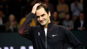 Switzerland's Roger Federer reacts as he speaks to the audience after victory over Netherlands Robin Haase in their quarter-final singles tennis match for the ABN AMRO World Tennis Tournament in Rotterdam on February 16, 2018.
Roger Federer became