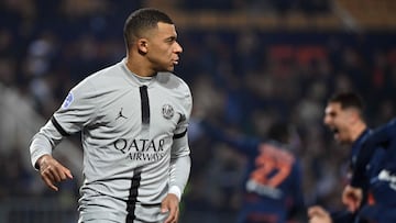 Paris Saint-Germain's French forward Kylian Mbappe reacts after missing a penalty during the French L1 football match between Montpellier Herault SC and Paris Saint-Germain (PSG) at Stade de la Mosson in Montpellier, southern France on February 1, 2023. (Photo by Sylvain THOMAS / AFP)