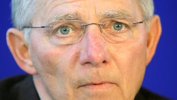 FILE PHOTO: German Interior Minister Wolfgang Schaeuble addresses a news conference after the public sector wage talks in Potsdam March 31, 2008. REUTERS/Hannibal Hanschke/File Photo