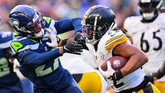 SEATTLE, WASHINGTON - DECEMBER 31: Najee Harris #22 of the Pittsburgh Steelers runs for a first down against the Seattle Seahawks during the fourth quarter at Lumen Field on December 31, 2023 in Seattle, Washington.   Conor Courtney/Getty Images/AFP (Photo by Conor Courtney / GETTY IMAGES NORTH AMERICA / Getty Images via AFP)