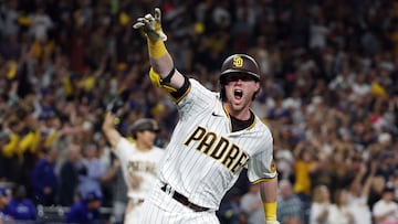 SAN DIEGO, CALIFORNIA - OCTOBER 15: Jake Cronenworth #9 of the San Diego Padres celebrates after hitting a two-run RBI single during the seventh inning against the Los Angeles Dodgers in game four of the National League Division Series at PETCO Park on October 15, 2022 in San Diego, California.   Harry How/Getty Images/AFP