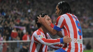 MADRID, SPAIN - NOVEMBER 25: Adra Turan (L) of Club Atletico de Madrid celebrates with Radamel Falcao after scoring his team's 2nd goal during the La Liga match between Club Atletico de Madrid and Sevilla FC at Vicente Calderon Stadium on November 25, 2012 in Madrid, Spain. (Photo by Denis Doyle/Getty Images)