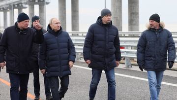 Russian President Vladimir Putin listens to Deputy Prime Minister Marat Khusnullin as he visits a bridge connecting the Russian mainland with the Crimean Peninsula across the Kerch Strait, December 5, 2022. Sputnik/Mikhail Metzel/Pool via REUTERS ATTENTION EDITORS - THIS IMAGE WAS PROVIDED BY A THIRD PARTY.