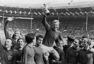 Prestige remains: England captain Bobby Moore holds up the Jules Rimet trophy as he is carried on the shoulders of his team-mates after their 4-2 victory over West Germany in the World Cup Final at Wembley Stadium.