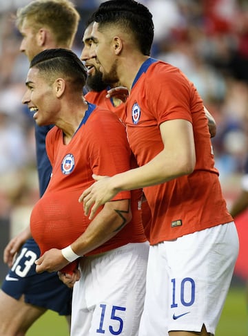 Chile defender Óscar Opazo (15), celebrates his goal with midfielder Diego Valdés (10) during the first half of an international friendly soccer match against the United States, Tuesday, March 26, 2019, in Houston. (AP Photo/Eric Christian Smith)