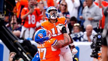 Oct 26, 2025; Denver, Colorado, USA; Denver Broncos wide receiver Troy Franklin (11) celebrates with guard Quinn Meinerz (77) after scoring touchdown against the Dallas Cowboys in the fourth quarter at Empower Field at Mile High. Mandatory Credit: Ron Chenoy-Imagn Images