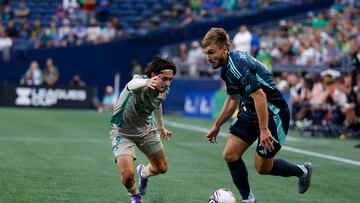 Aug 3, 2025; Seattle, WA, USA; Seattle Sounders FC forward Pedro De La Vega (10) dribbles against Santos Laguna midfielder Jordan Carrillo (9) during the first half at Lumen Field. Mandatory Credit: Joe Nicholson-Imagn Images