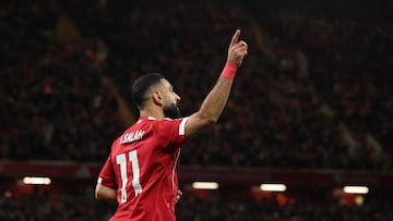 Soccer Football - Premier League - Liverpool v Brighton & Hove Albion - Anfield, Liverpool, Britain - December 13, 2025 Liverpool's Mohamed Salah celebrates after Hugo Ekitike scores their second goal REUTERS/Phil Noble EDITORIAL USE ONLY. NO USE WITH UNAUTHORIZED AUDIO, VIDEO, DATA, FIXTURE LISTS, CLUB/LEAGUE LOGOS OR 'LIVE' SERVICES. ONLINE IN-MATCH USE LIMITED TO 120 IMAGES, NO VIDEO EMULATION. NO USE IN BETTING, GAMES OR SINGLE CLUB/LEAGUE/PLAYER PUBLICATIONS. PLEASE CONTACT YOUR ACCOUNT REPRESENTATIVE FOR FURTHER DETAILS..