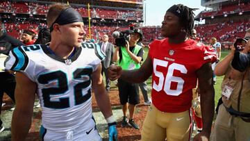 (FILES) In this file photo taken on September 10, 2017  Christian McCaffrey #22 of the Carolina Panthers talks to Reuben Foster #56 of the San Francisco 49ers after their game at Levi&#039;s Stadium in Santa Clara, California. - The San Francisco 49ers said on November 25, 2018 the club was releasing linebacker Reuben Foster following an arrest for domestic violence in Florida on Saturday. Foster, 24, was taken into police custody late Saturday following the allegations at the team hotel in Tampa, where the 49ers are due to face the Buccaneers later on Sunday. (Photo by EZRA SHAW / GETTY IMAGES NORTH AMERICA / AFP)