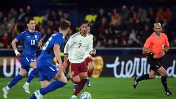 Spain's forward #07 Ferran Torres is challenged by Serbia's midfielder #10 Sasa Lukic during the international friendly football match between Spain and Serbia at La Ceramica Stadium in Vila-real on March 27, 2026. (Photo by JOSE JORDAN / AFP)