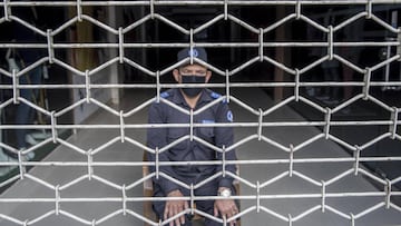 Kathmandu (Nepal), 13/05/2020.- A security guard wearing a protective face mask sits in a closed super market, in Kathmandu, Nepal, 13 May 2020. Nepal has been on lockdown due to the coronavirus pandemic for 51 days and has recorded over 200 cases of coro