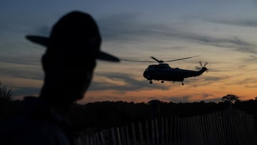 A state trooper keeps watch as U.S. President Joe Biden arrives aboard Marine One for his vacation in Rehoboth Beach, Delaware, U.S., August 20, 2022. REUTERS/Kevin Lamarque
