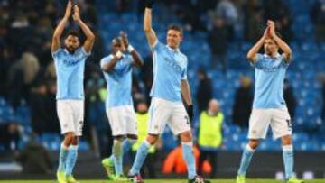 Gael Clichy, Martín Demichelis y Jesús Navas, jugadores del Manchester United.