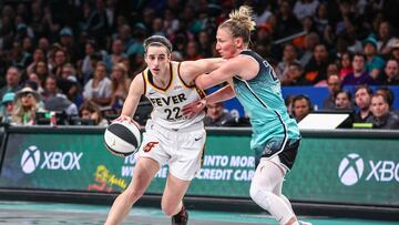 Jun 2, 2024; Brooklyn, New York, USA; Indiana Fever guard Caitlin Clark (22) looks to drive past New York Liberty guard Courtney Vandersloot (22) in the second quarter at Barclays Center. Mandatory Credit: Wendell Cruz-USA TODAY Sports