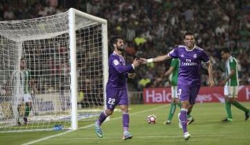 Real Madrid's Isco, left, celebrates with teammate Pepe after scoring against Betis during their La Liga soccer match at the Benito Villamarin stadium, in Seville, Spain on Saturday, Oct. 15, 2016. (AP Photo/Angel Fernandez)