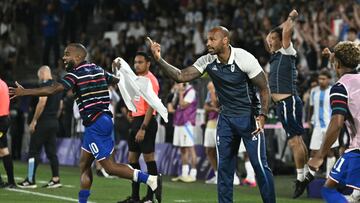 France's coach Thierry Henry reacts after France won the men's quarter-final football match between France and Argentina during the Paris 2024 Olympic Games at the Bordeaux Stadium in Bordeaux on August 2, 2024. (Photo by Philippe LOPEZ / AFP)