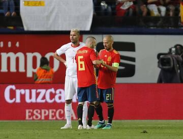 Silva accepts the armband off Andres Iniesta.