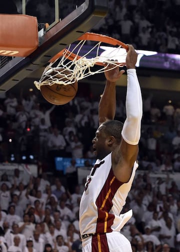 Heat guard Dwyane Wade dunks on the Raptors during the second half in game four.