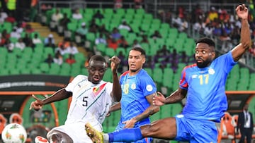 Guinea's defender #5 Mouctar Diakhaby (L) fights for the ball with DR Congo's midfielder #18 Charles Pickel (C) and DR Congo's forward #17 Cedric Bakambu during the Africa Cup of Nations (CAN) 2024 quarter-final football match between DR Congo and Guinea at the Alassane Ouattara Stadium in Ebimpe, Abidjan on February 2, 2024. (Photo by SIA KAMBOU / AFP)