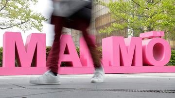 A person walks past a Malmo sign outside the Malmo Arena, the venue for the Eurovision Song Contest, in Malmo, Sweden, May 6, 2024. REUTERS/Leonhard Foeger