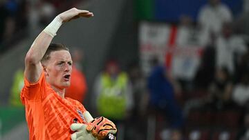 England's goalkeeper #01 Jordan Pickford reacts on the pitch after the UEFA Euro 2024 Group C football match between England and Slovenia at the Cologne Stadium in Cologne on June 25, 2024. (Photo by JAVIER SORIANO / AFP)