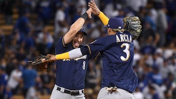 LOS ANGELES, CA - OCTOBER 15: Ryan Braun #8 and Orlando Arcia #3 of the Milwaukee Brewers celebrate after they defeated the Los Angeles Dodgers 4-0 in Game Three of the National League Championship Series at Dodger Stadium on October 15, 2018 in Los Angel