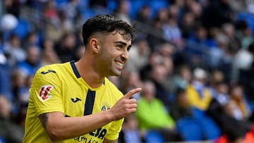Villarreal's Spanish forward #20 Alberto Moleiro celebrates scoring his team's second goal during the Spanish league football match between Real Sociedad and Villarreal CF at Anoeta Stadium in San Sebastian on November 30, 2025. (Photo by ANDER GILLENEA / AFP)