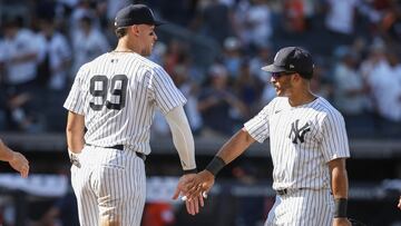 Aug 9, 2025; Bronx, New York, USA; New York Yankees designated hitter Aaron Judge (99) and center fielder Trent Grisham (12) celebrate after defeating the Houston Astros 5-4 at Yankee Stadium. Mandatory Credit: Wendell Cruz-Imagn Images