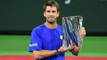 Cameron Norrie of Great Britain poses with the winner&#039;s trophy after victory over Nikoloz Basilashvili of Georgia in their men&#039;s final match at the Indian Wells tennis tournament on October 17, 2021 in Indian Wells, California. - Cameron Norrie&#039;s breakthrough season reached a high point in the California desert on Sunday with a 3-6, 6-4, 6-1 win over Nikoloz Basilashvili to become the first Briton to win the ATP Indian Wells title.
 Norrie rallied from a set down to earn his career best 47th win of the season and is the first player from Britain to lift the trophy, achieving what former finalists Andy Murray, Tim Henman and Greg Rusedski failed to do. (Photo by Frederic J. BROWN / AFP)