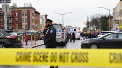 Members of the New York Police Department and emergency vehicles crowd the streets after at least 13 people were injured during a rush-hour shooting at a subway station in the New York borough of Brooklyn on April 12, 2022, where authorities said "several undetonated devices" were recovered amid chaotic scenes. - Ambulances lined the street outside the 36th Street subway station, where a New York police spokeswoman told AFP officers responded to a 911 call of a person shot at 8:27 am (1227 GMT). The suspect was still at large, according to Manhattan borough president Mark Levine. (Photo by ANGELA WEISS / AFP) (Photo by ANGELA WEISS/AFP via Getty Images)