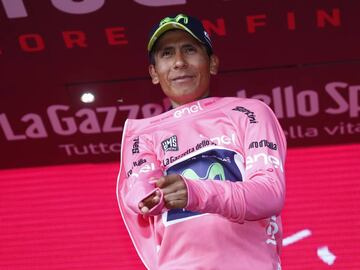 Colombia&#039;s Nairo Quintana of team Movistar celebrates the pink jersey of the overall leader on the podium after winning the 9th stage of the 100th Giro d&#039;Italia, Tour of Italy, cycling race from Montenero di Bisaccia to Blockhaus on May 14, 2017. 
 Colombia&#039;s Nairo Quintana soared to victory on a dramatic ninth stage of the Giro d&#039;Italia on Sunday to claim the race leader&#039;s pink jersey. Movistar&#039;s Quintana came over the finish line 23secs ahead of Frenchman Thibaut Pinot and Dutchman Tom Dumoulin, to wrest the race lead from Luxembourg&#039;s Bob Jungels.
  / AFP PHOTO / Luk BENIES