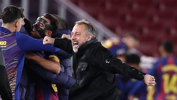 Barcelona's German coach Hans-Dieter Flick celebrates his team's third goal during the Spanish league football match between FC Barcelona and Club Atletico de Madrid at Camp Nou Stadium in Barcelona on December 2, 2025. (Photo by Josep LAGO / AFP)