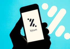 In this photo illustration a Bizum logo seen displayed on a smartphone with a Bizum logo in the background. (Photo by DAX Images/NurPhoto via Getty Images)