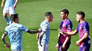 VIGO, SPAIN - FEBRUARY 28: Iago Aspas of Celta Vigo clashes with Joao Filipe of Real Valladolid during the La Liga Santander match between RC Celta and Real Valladolid CF at Abanca-Bala&iacute;dos on February 28, 2021 in Vigo, Spain. Sporting stadiums aro