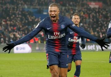 Kylian Mbappé celebrates scoring PSG's eighth goal.