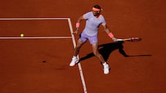 Spain's Rafael Nadal returns the ball to Italy's Flavio Cobolli during the ATP Barcelona Open "Conde de Godo" tennis tournament singles match at the Real Club de Tenis in Barcelona, on April 16, 2024. (Photo by PAU BARRENA / AFP)