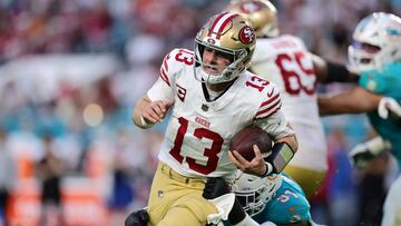 MIAMI GARDENS, FLORIDA - DECEMBER 22: Emmanuel Ogbah #91 of the Miami Dolphins tackles Brock Purdy #13 of the San Francisco 49ers during the second quarter at Hard Rock Stadium on December 22, 2024 in Miami Gardens, Florida. Carmen Mandato/Getty Images/AFP (Photo by Carmen Mandato / GETTY IMAGES NORTH AMERICA / Getty Images via AFP)