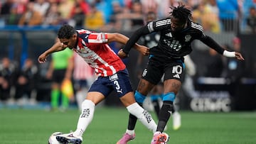 Aug 3, 2025; Charlotte, NC, USA; Chivas de Guadalajara defender Gilberto Sepulveda (3) steals the ball from Charlotte FC forward Wilfried Zaha (10) during the first half at Bank of America Stadium. Mandatory Credit: Jim Dedmon-Imagn Images