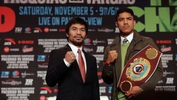 Boxers Manny Pacquiao (L) of the Philippines and Jessie Vargas of the US pose during their final news conference at The Wynn Las Vegas on November 2, 2016. Pacquiao will challenge Vargas for the WBO Welterweight Championship title November 5, 2016 at the Thomas & Mack Center in Las Vegas. / AFP PHOTO / John GURZINSKI