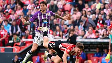 Athletic Bilbao's Spanish midfielder #23 Mikel Jauregizar Alboniga (R) tumbles next to Real Valladolid's Croatian midfielder #20 Stanko Juric during the Spanish league football match between Athletic Club Bilbao and Real Valladolid FC at San Mames Stadium in Bilbao on February 23, 2025. (Photo by ANDER GILLENEA / AFP)