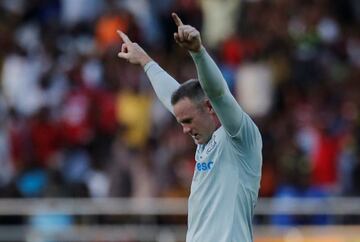 Everton's Wayne Rooney points to the sky after scoring with a fine strike.