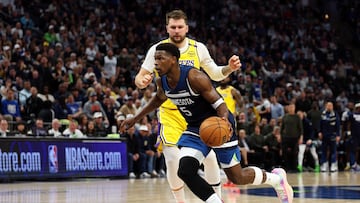 MINNEAPOLIS, MINNESOTA - APRIL 25: Anthony Edwards #5 of the Minnesota Timberwolves drives to the basket against Luka Doncic #77 of the Los Angeles Lakers in the third quarter of Game Three of the First Round of the 2025 NBA Playoffs at Target Center on April 25, 2025 in Minneapolis, Minnesota. The Timberwolves defeated the Lakers 116-104 to take a 2-1 series lead. NOTE TO USER: User expressly acknowledges and agrees that, by downloading and or using this photograph, User is consenting to the terms and conditions of the Getty Images License Agreement. David Berding/Getty Images/AFP (Photo by David Berding / GETTY IMAGES NORTH AMERICA / Getty Images via AFP)