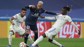 MADRID, SPAIN - MARCH 09: Neymar JR (2ndL) of Paris Saint-Germain competes for the ball with Rodrygo Goes (L) of Real Madrid CF and his teammate Eduardo Camavinga (R) during the UEFA Champions League Round Of Sixteen Leg Two match between Real Madrid and