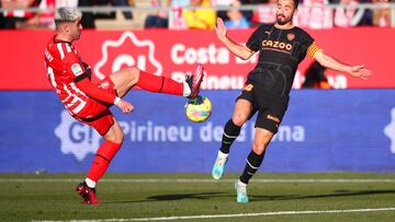 GIRONA, SPAIN - FEBRUARY 05: Valery Fernandez of Girona FC battles for possession with Jose Luis Gaya of Valencia CF during the LaLiga Santander match between Girona FC and Valencia CF at Montilivi Stadium on February 05, 2023 in Girona, Spain. (Photo by Eric Alonso/Getty Images)
