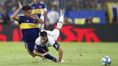 Boca Juniors&#039; Carlos Zambrano and Gimnasia y Esgrima&#039;s Matias Perez vie for the ball during an Argentina&#039;s soccer league match at La Bombonera stadium in Buenos Aires, Argentina, Saturday, March 7, 2020. (AP Photo/Natacha Pisarenko)