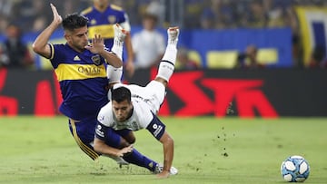 Boca Juniors&#039; Carlos Zambrano and Gimnasia y Esgrima&#039;s Matias Perez vie for the ball during an Argentina&#039;s soccer league match at La Bombonera stadium in Buenos Aires, Argentina, Saturday, March 7, 2020. (AP Photo/Natacha Pisarenko)